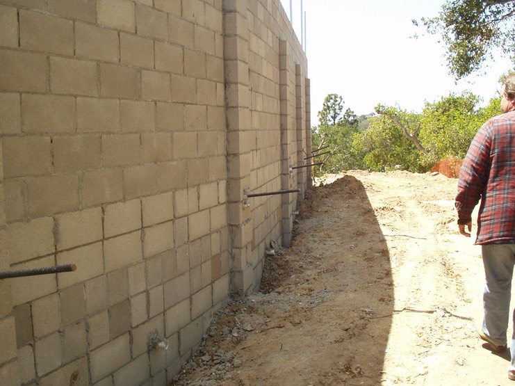 Design and Inspection of New Retaining Wall with CMU and Helical Screw Tiebacks