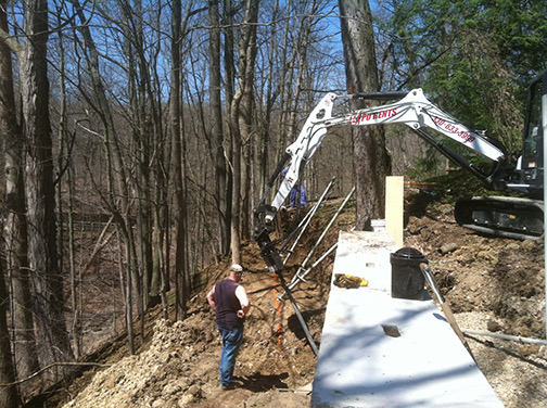 mft residential Installing helical screw piles for a replacement retaining wall